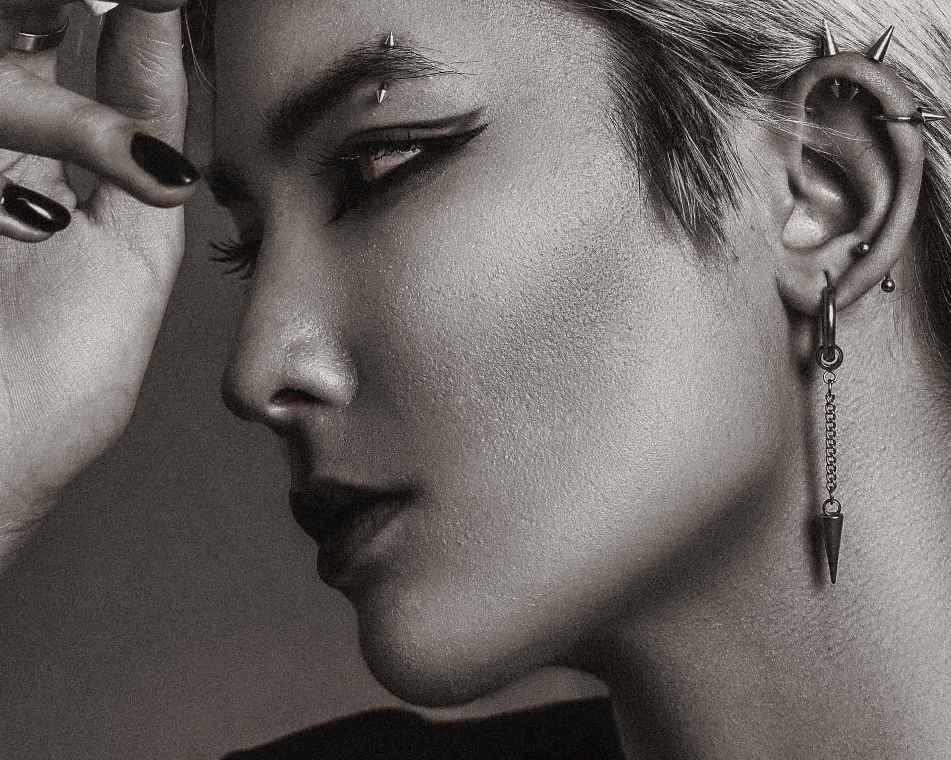 Small stud earring in a pierced ear, photographed closely